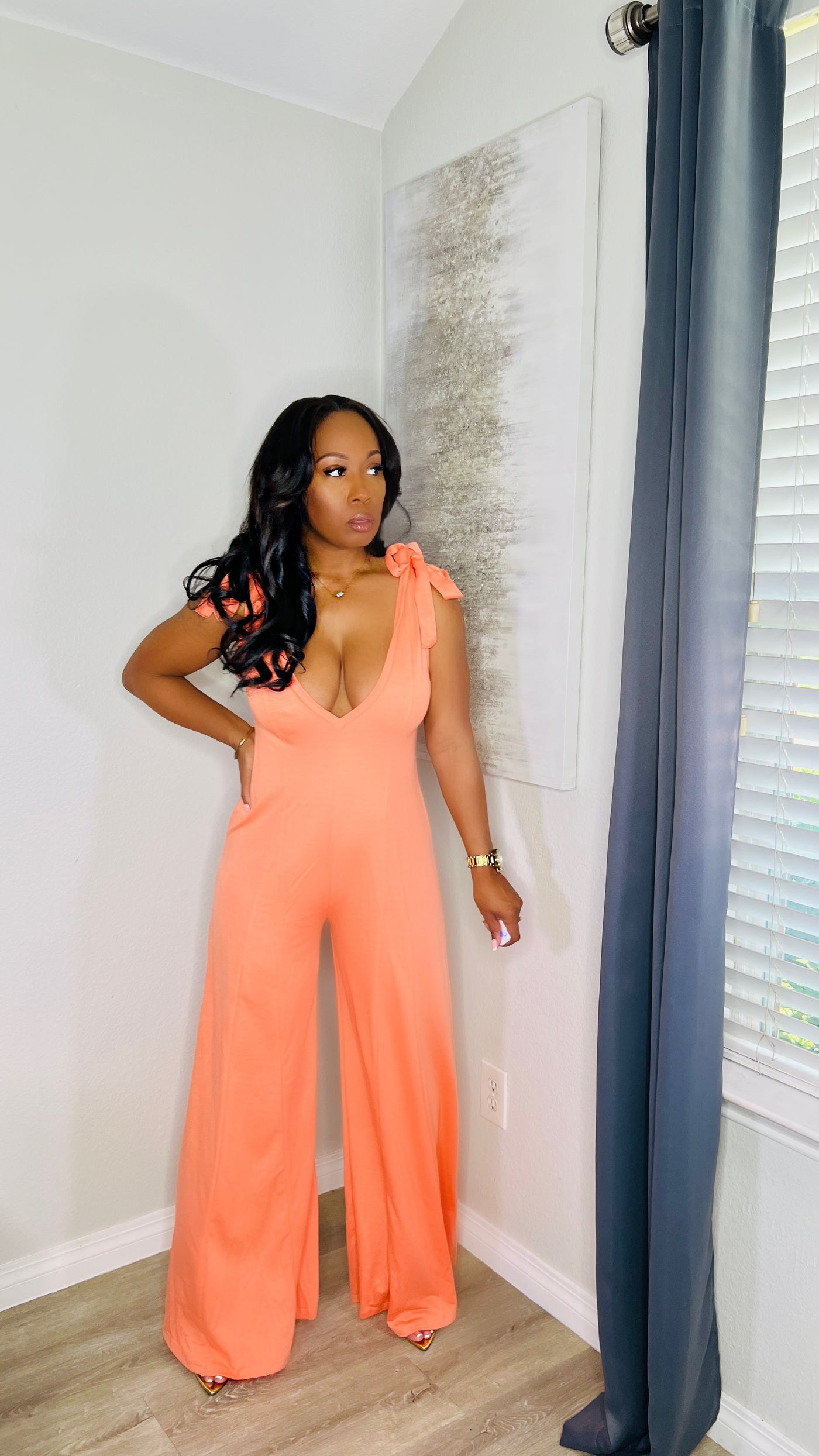Perfect Peach Jumpsuit featuring a self-tie for a perfect fit, in peach color.