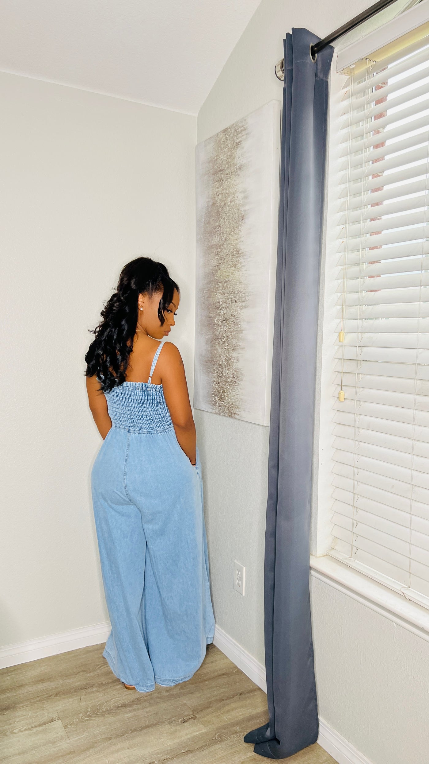 Close-up of the My Way Denim Jumpsuit highlighting the stretchy fabric and flattering fit.