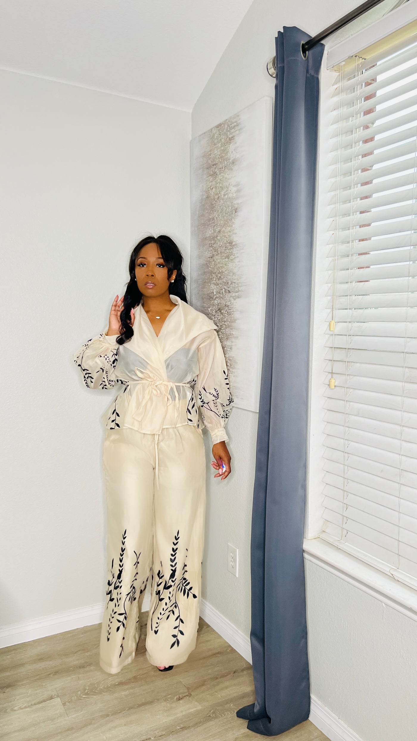 The Classic Pant Set in cream, featuring a V-neck top with long sleeves and a self-tie belt